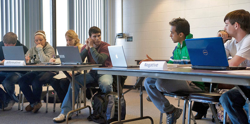 Students debating during an ethics class taught by ISU professor William Wilhelm