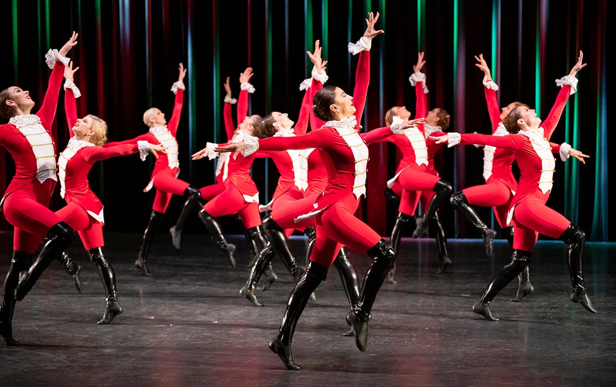 Image of dancers all dressed in Christmas clothes performing for a Rand Tinsel-Toes